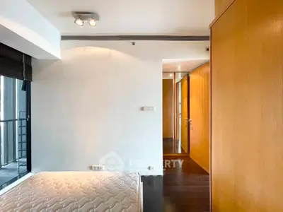 Modern bedroom with wooden accents and natural light