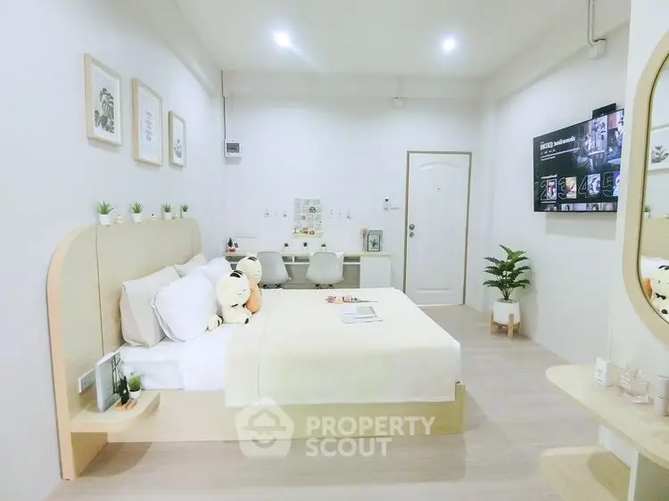 Modern minimalist bedroom with cozy decor and stylish furnishings
