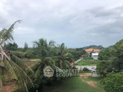Lush tropical oasis with expansive garden views, offering a serene and private outdoor living experience in a prime location.