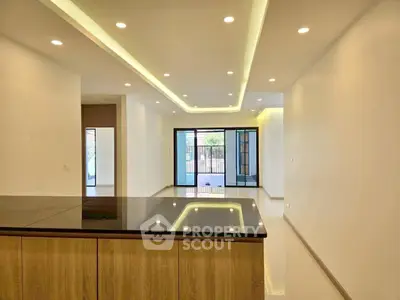 Spacious modern living room with sleek lighting and open layout