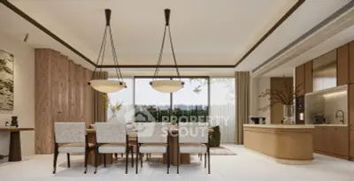 Luxurious open-plan dining and kitchen area with elegant lighting and large windows.