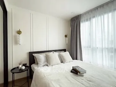 Elegant bedroom with modern decor and natural light