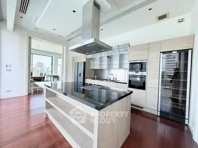 Luxurious modern kitchen with sleek appliances and city view, perfect for culinary enthusiasts.