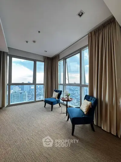 Stunning corner unit with panoramic city views and elegant seating area.