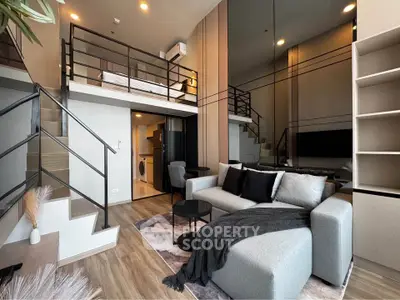 Modern loft apartment with stylish living room and mezzanine bedroom, featuring sleek design and cozy ambiance.