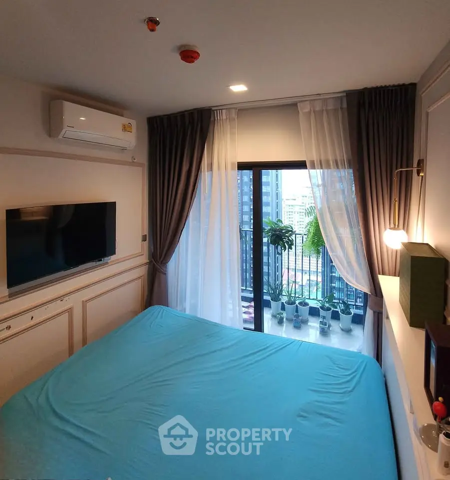 Cozy bedroom with balcony view in modern apartment