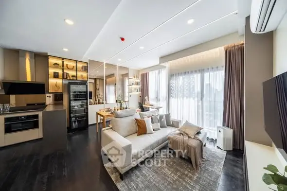 Modern open-plan living room with stylish kitchen and large windows.