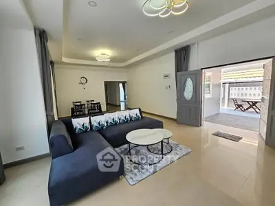 Spacious living room with modern decor and elegant lighting in a stylish home