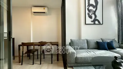 Modern living room with stylish furniture and air conditioning in a cozy apartment.