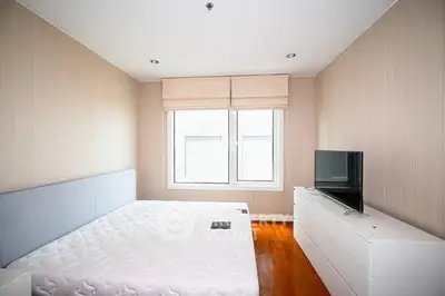 Bright and cozy bedroom with modern furnishings and natural light