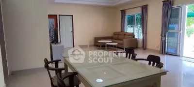Spacious living room with modern furniture and large windows for natural light.