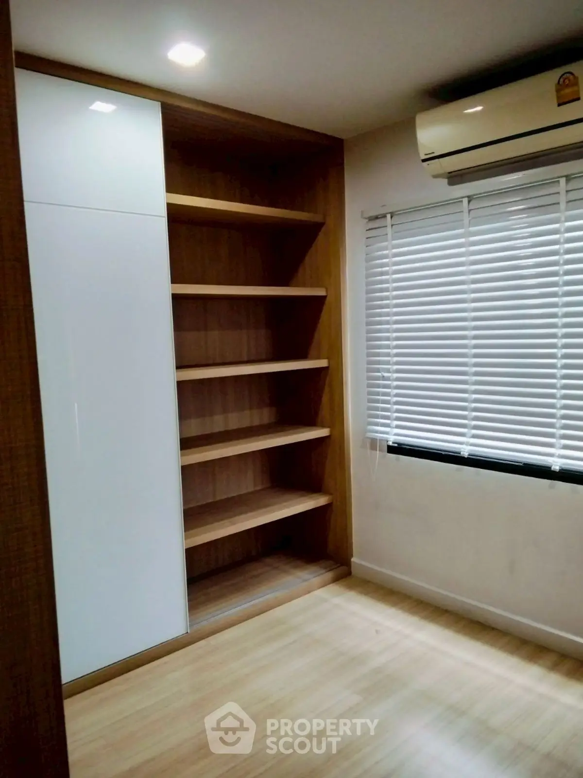 Modern storage room with built-in shelves and air conditioning
