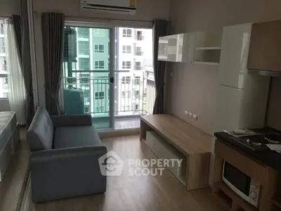 Modern living room with balcony view in high-rise apartment