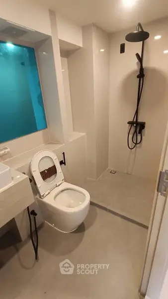 Modern bathroom with sleek shower and contemporary toilet design