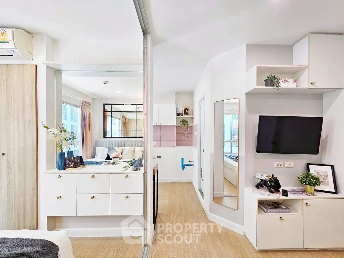 Modern open-plan living space with stylish decor and natural light