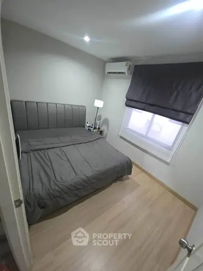 Cozy modern bedroom with stylish decor and natural light