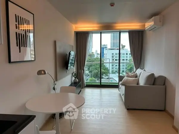 Modern living room with balcony view in urban apartment