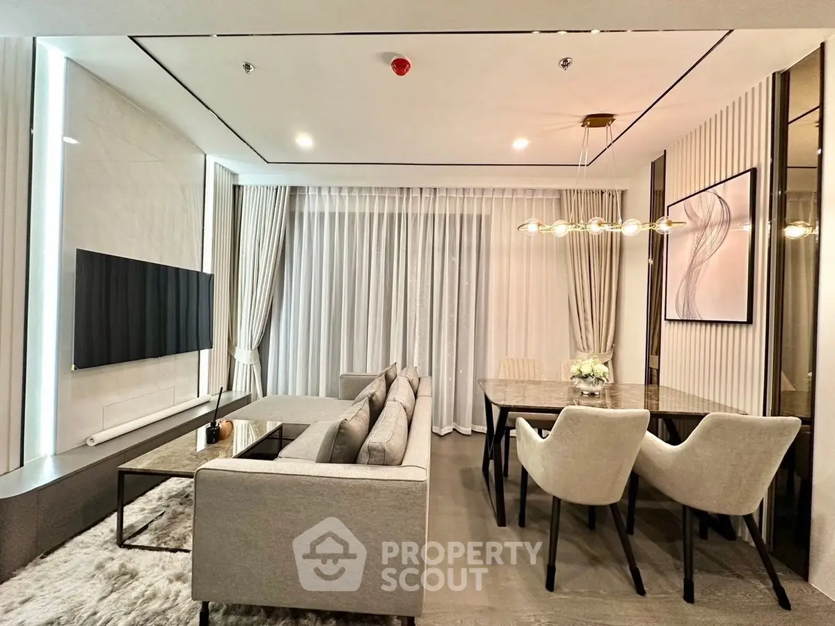 Elegant modern living room with stylish decor and open dining area