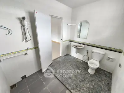 Spacious bathroom with modern fixtures and elegant tile flooring