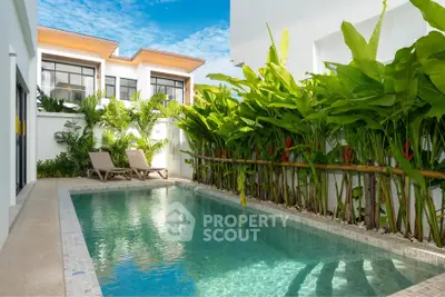 Luxurious private pool with lush greenery in modern villa setting