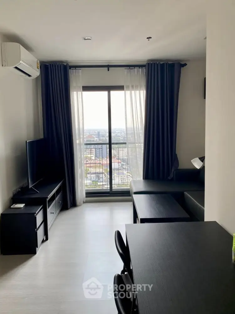 Modern living room with city view, sleek furniture, and natural light.