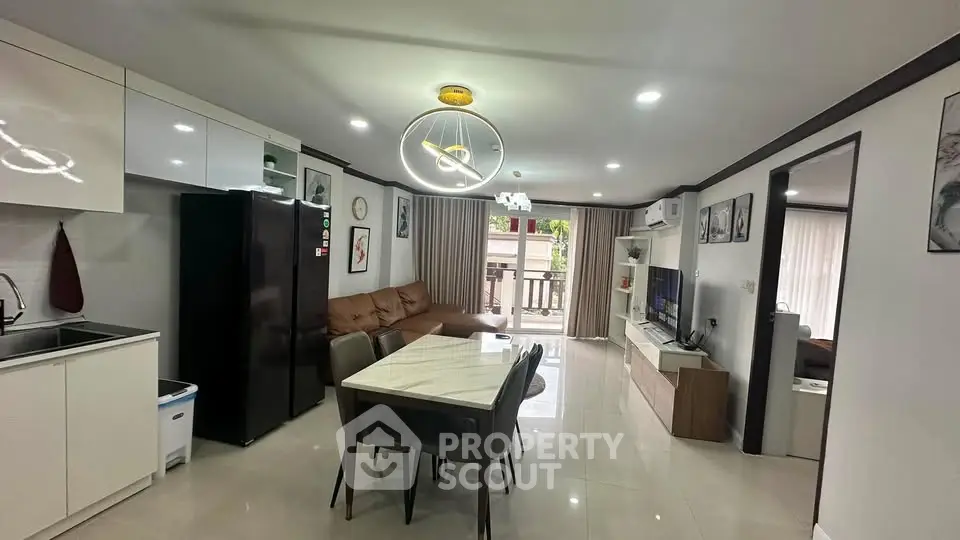 Spacious modern living room with open kitchen and stylish decor