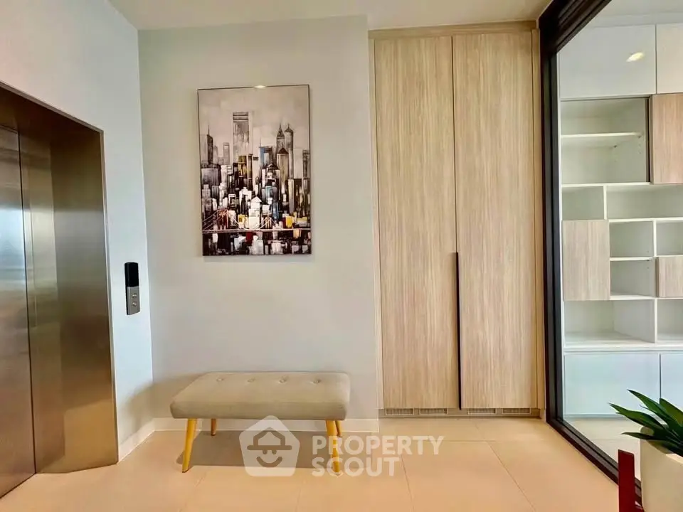 Modern apartment entrance with elevator and stylish decor