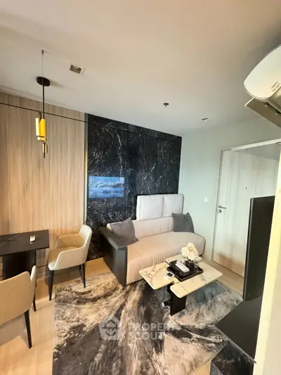 Modern living room with elegant decor and stylish furniture in a luxury apartment.
