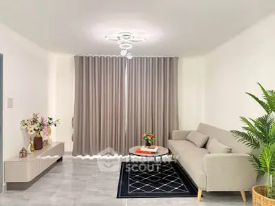 Modern living room with elegant decor and cozy sofa