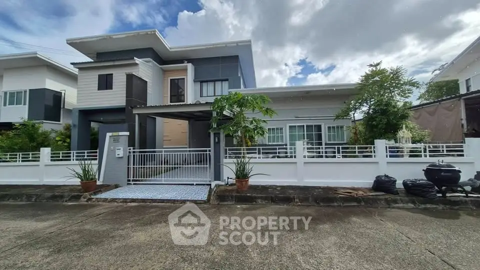 Modern two-story house with sleek design and spacious driveway