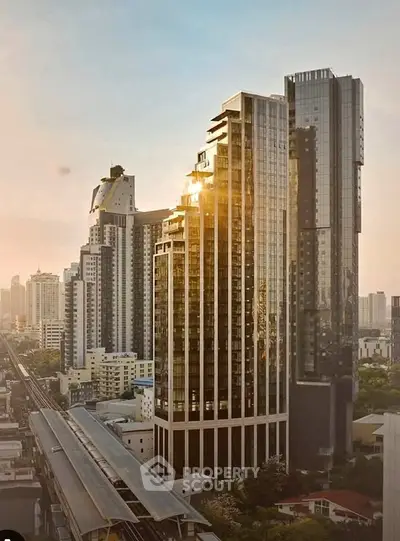 Stunning cityscape view of modern high-rise buildings at sunset, showcasing urban luxury living.
