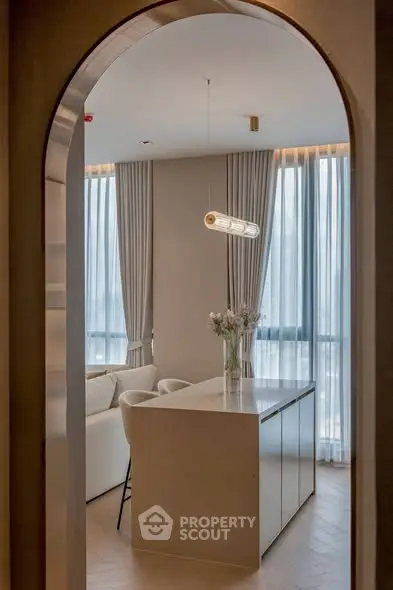 Elegant modern living room with stylish archway and natural light