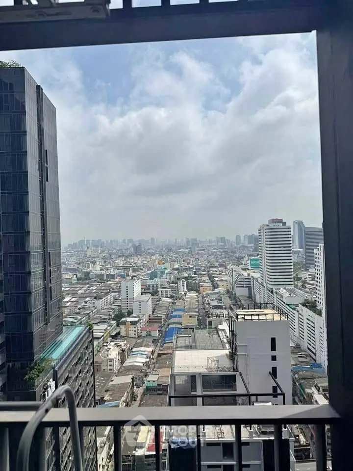 Stunning cityscape view from high-rise balcony showcasing urban skyline and architecture.