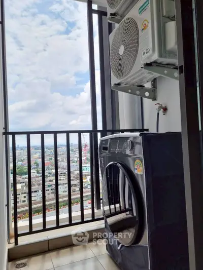 High-rise balcony with city view and modern washing machine setup.