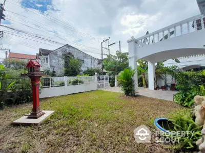 Charming garden view with lush greenery and spacious outdoor area in residential property