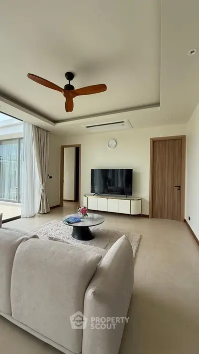 Spacious modern living room with elegant decor and natural light