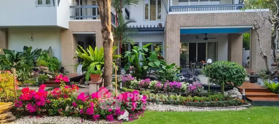 Beautiful garden view of modern home with vibrant flowers and lush greenery