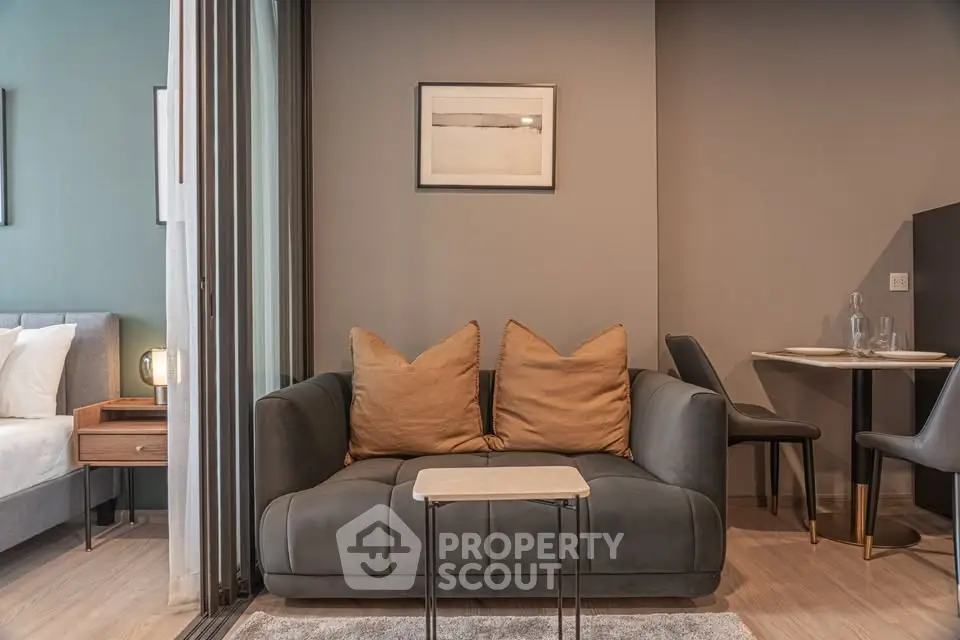 Modern living room with cozy sofa and dining area in stylish apartment