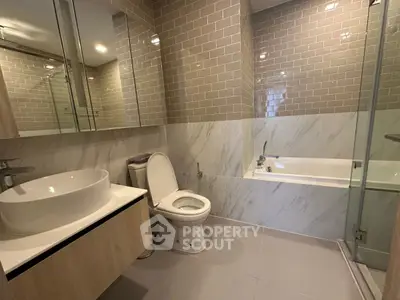 Modern bathroom with elegant fixtures and a sleek bathtub design