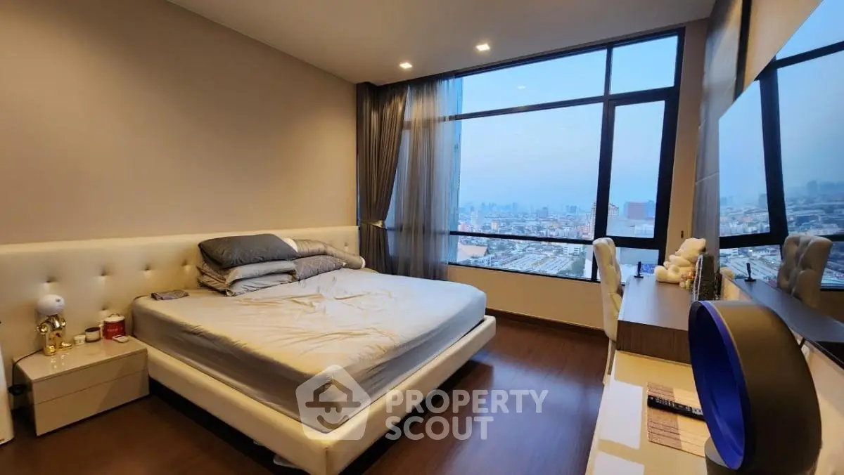 Luxurious bedroom with stunning city view and modern furnishings