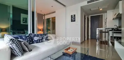 Modern living room with stylish decor and open kitchen layout