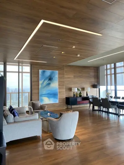 Luxurious modern living room with elegant decor and stunning city view.