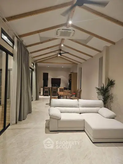 Spacious modern living room with high ceilings and elegant decor