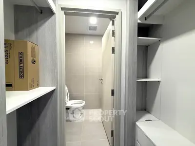 Modern bathroom with sleek storage and neutral tones