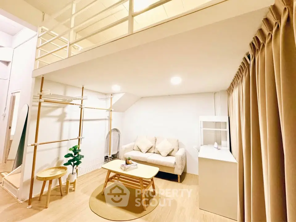 Modern loft-style living room with cozy sofa and wooden furniture