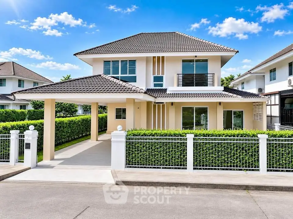 Stunning modern two-story house with manicured garden and spacious driveway in a serene neighborhood.