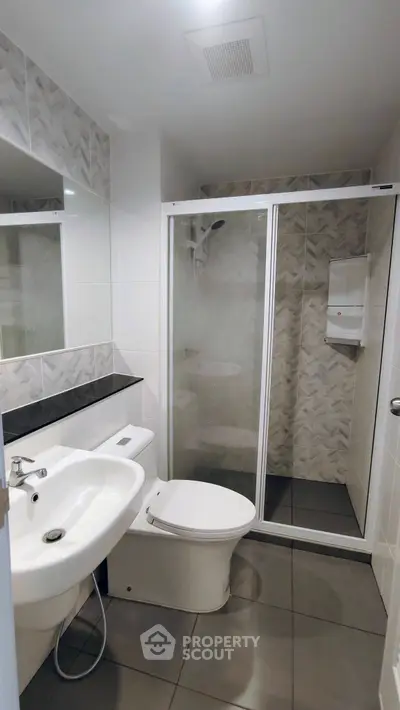 Modern bathroom with sleek shower and elegant tile design
