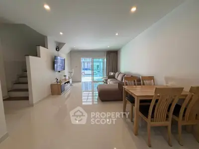 Spacious modern living room with sleek furniture and natural light