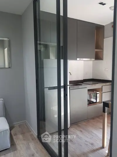 Modern kitchen with sleek design and open layout, featuring high-end appliances and stylish cabinetry.