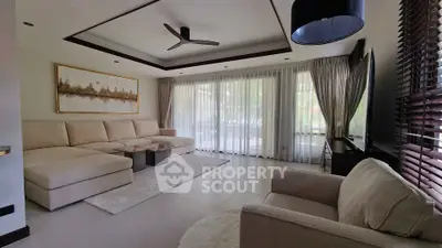 Spacious modern living room with elegant decor and large windows